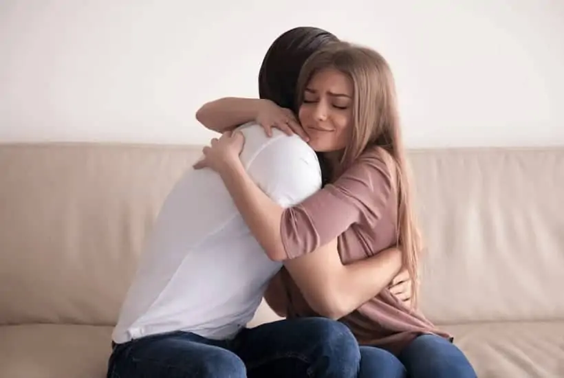 an image of a man and woman holding onto one another sitting on a couch featured an image for Forgive Like Jesus How Can You Learn To Forgive Like Jesus