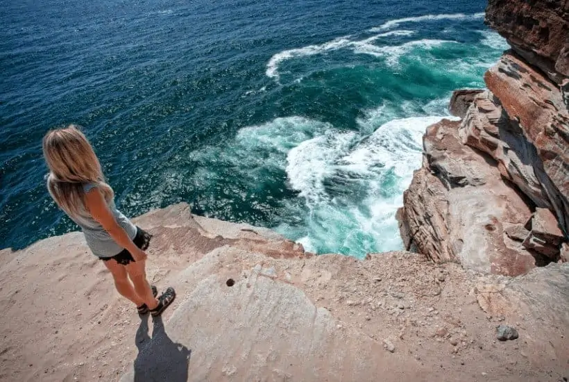 an image of a woman overlooking a cliff featured image for Are You Trusting God In All Circumstances Here Are 10 Ways To Tell