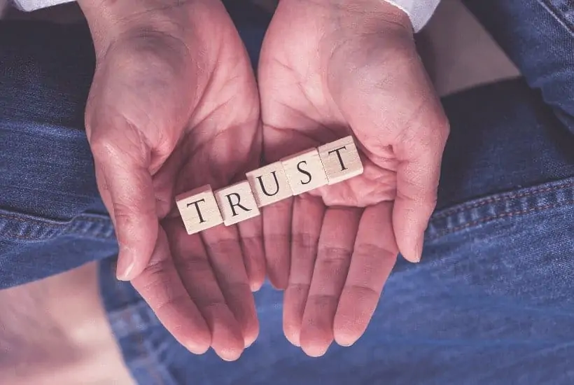 an image of a hand hold blocks that spell trust featured image for Are You Trusting God in Times of Uncertainty?